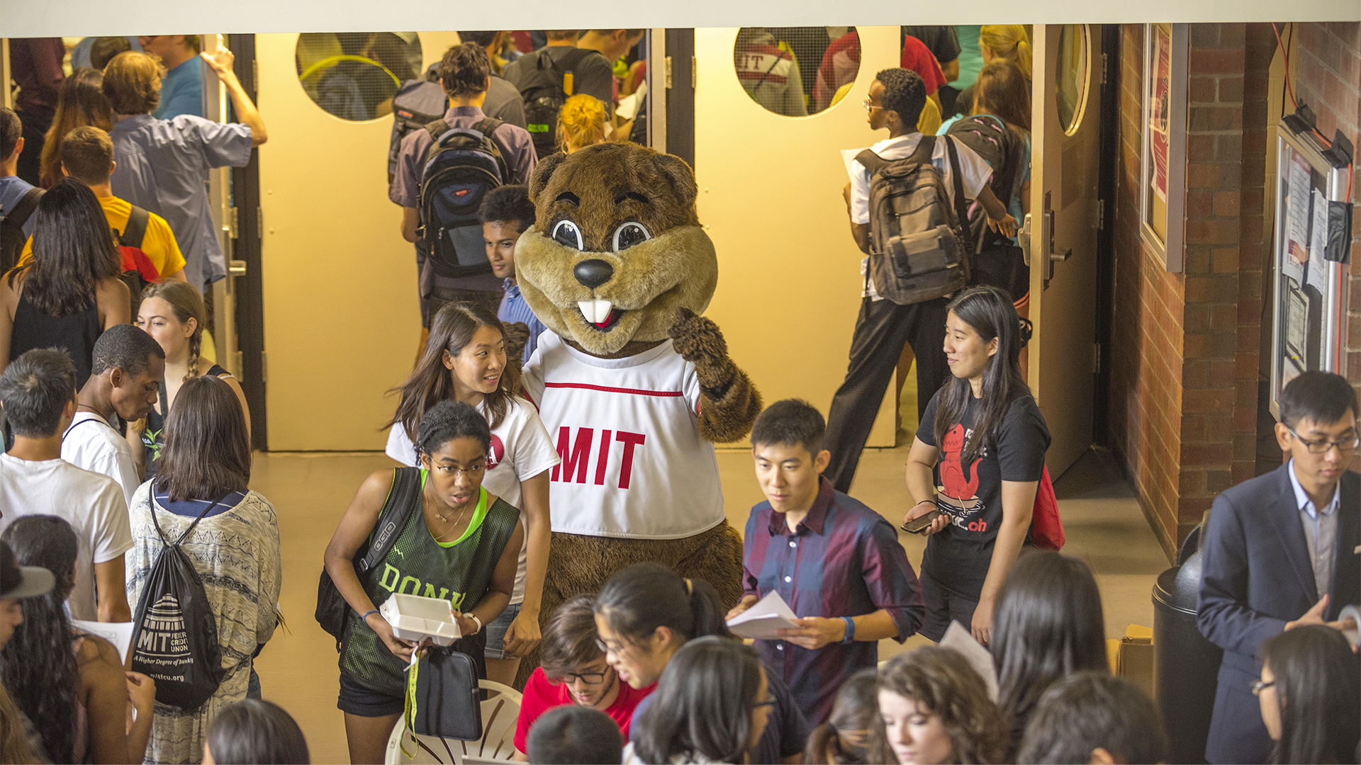 Students with Tim the Beaver in the Johnson Ice Arena